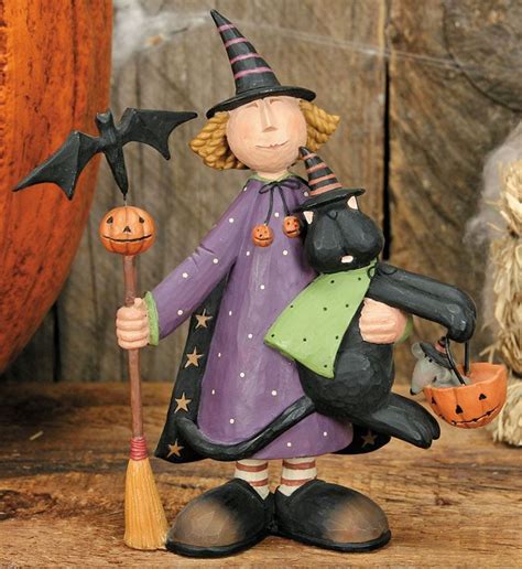 Halloween Enchantment: Witch Figurine Holding Stakes as a Focal Point
